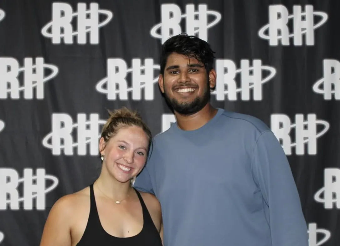 The winning pair in front of the RH monogram backdrop