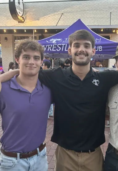Sam Sutton and Ty Parker under the Tarleton Wrestling Club tent