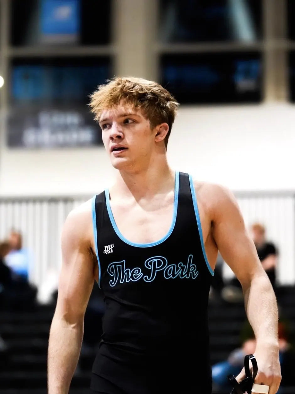 A Spain Park wrestler in the black The Park singlet